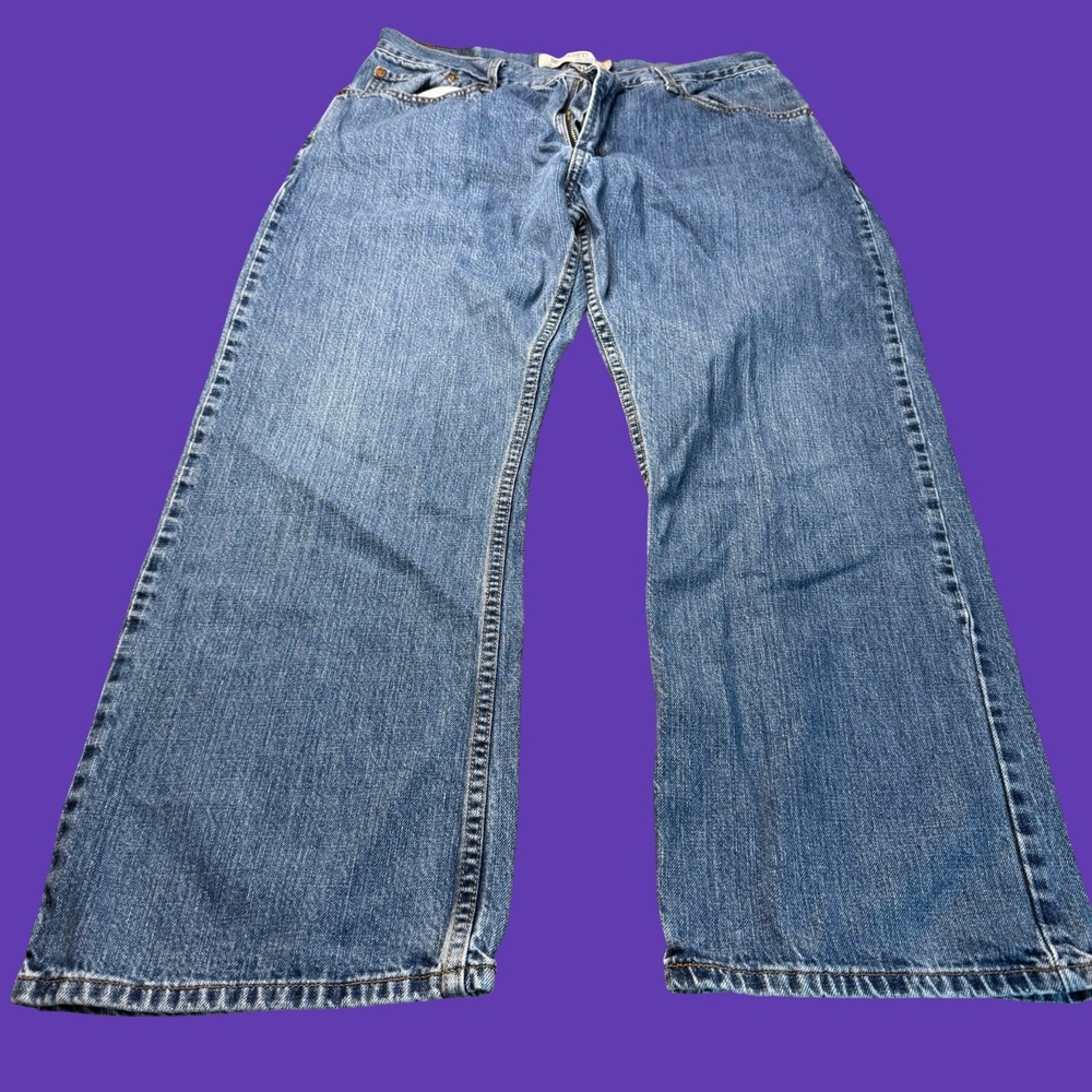 Levi's 557 Relaxed Boot Cut Jeans Blue Denim Medium Wash 33x27 Y2K